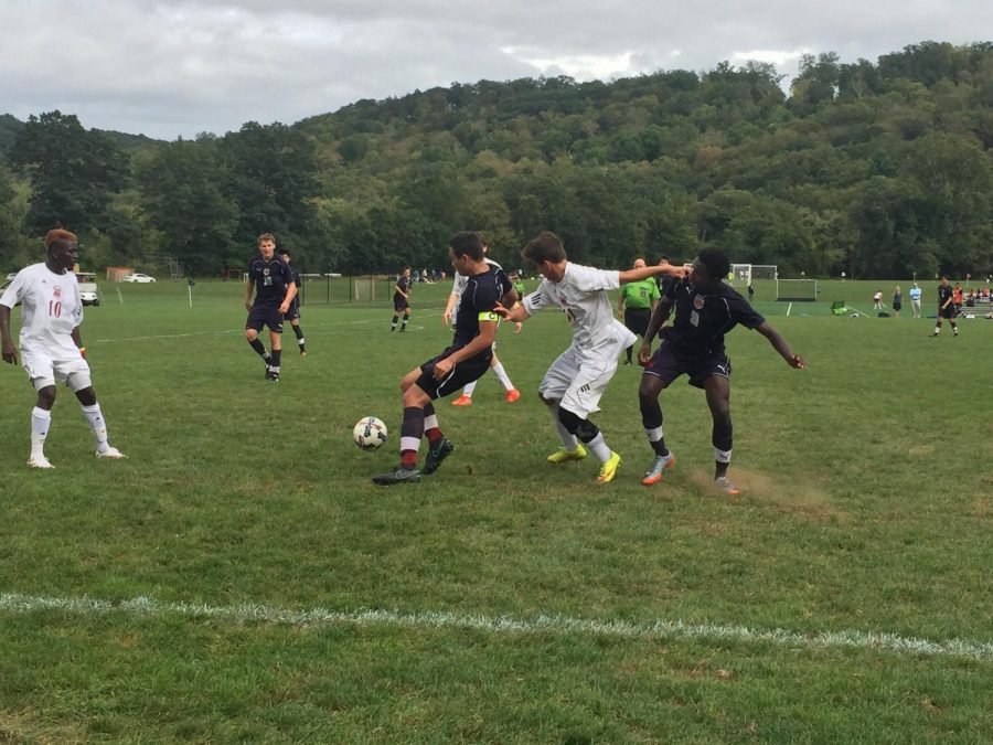 Battling for possession with Bridgton 