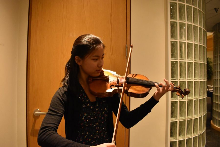 Carley Mitchell 22 plays the violin