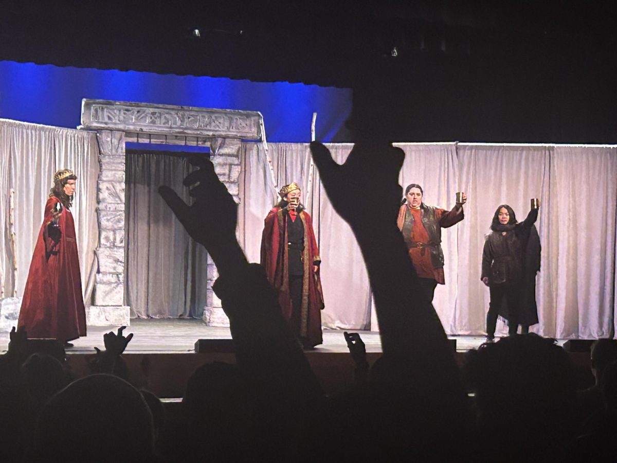 Audience members toast MACBETH