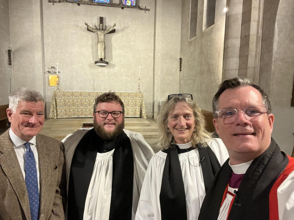 Bishop Mello pauses for a selfie with Mr. Hirschfeld, Reverend Cheney, and Dean Kelderman